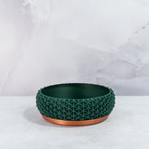 "Front view of empty STELLAR bowl planter with copper base and deep green forest pattern."